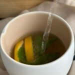 turmeric mint tea - pour hot water in a cup
