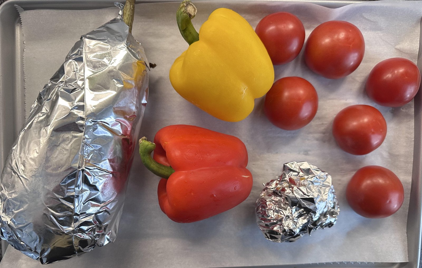 roasted vegetables a group of vegetables on a tray