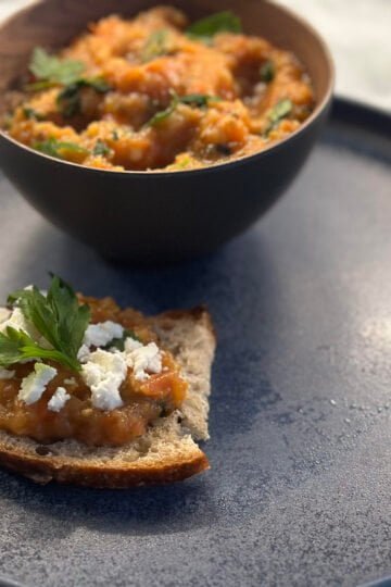 a bowl of food on a plate Roasted eggplant spread