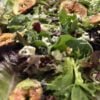 A bowl with figs and blue cheese maple glazed salad