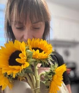 Biba at Chick in Apron smelling flowers