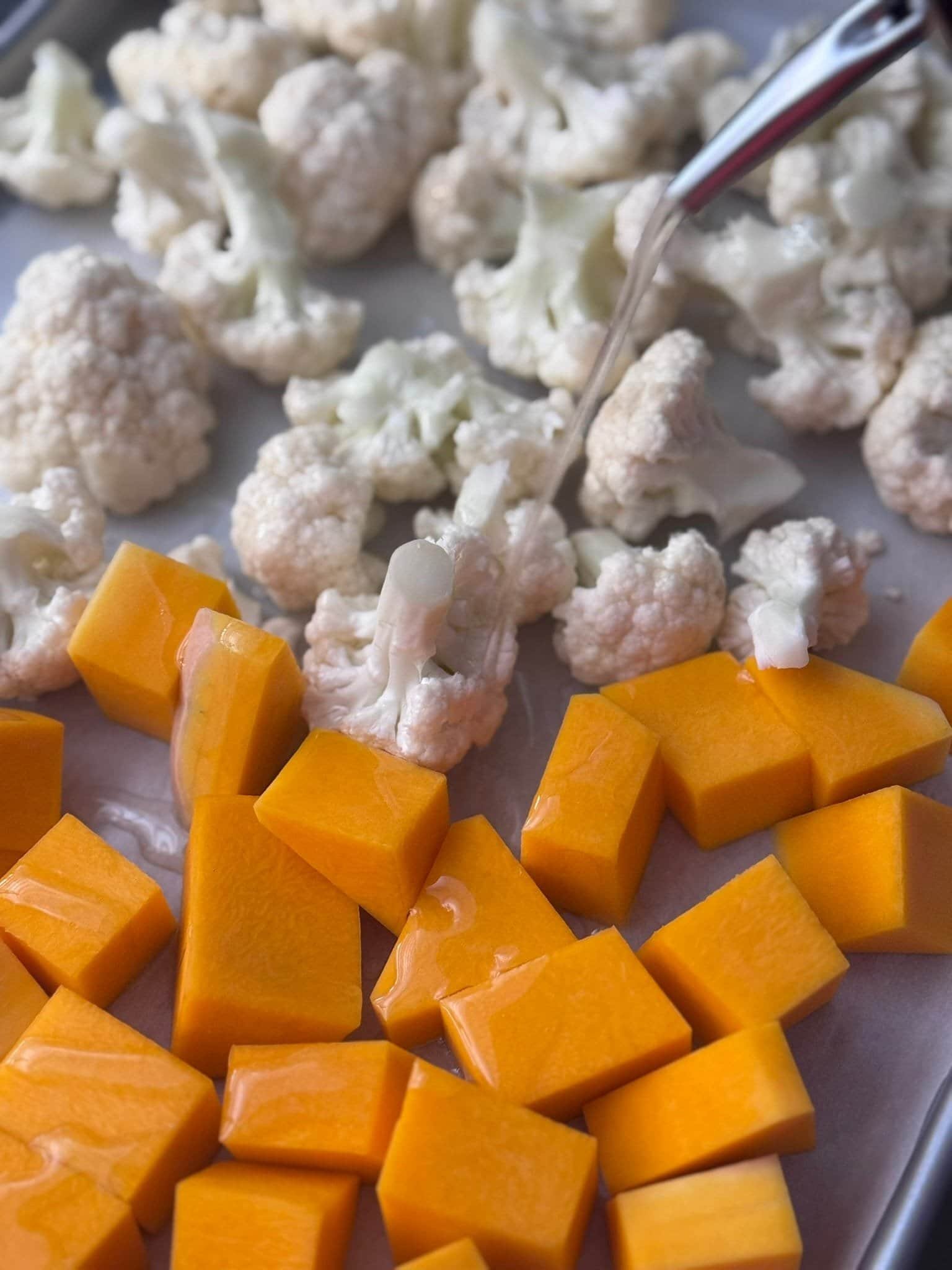IMG_6403 roasting pumpkin and cauliflower in a baking sheet