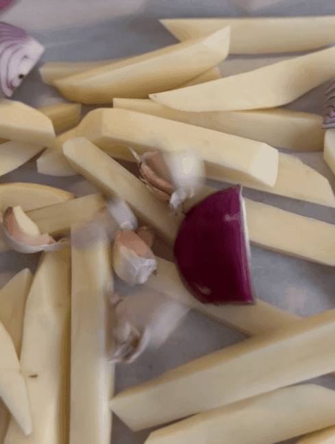 Screenshot 2024-10-04 174726 raw cut vegetables in a baking pan