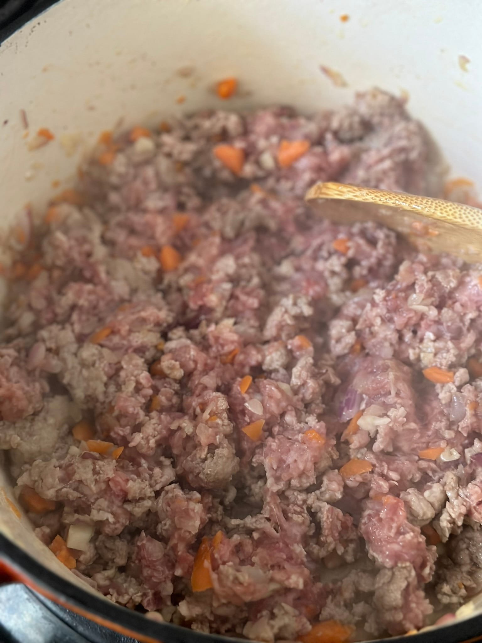 Classic Potato Moussaka Recipe cooking meat in a pot