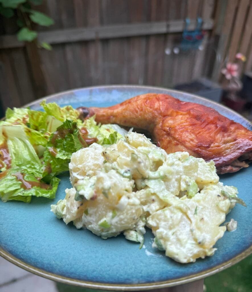 served potato salad with roasted chicken