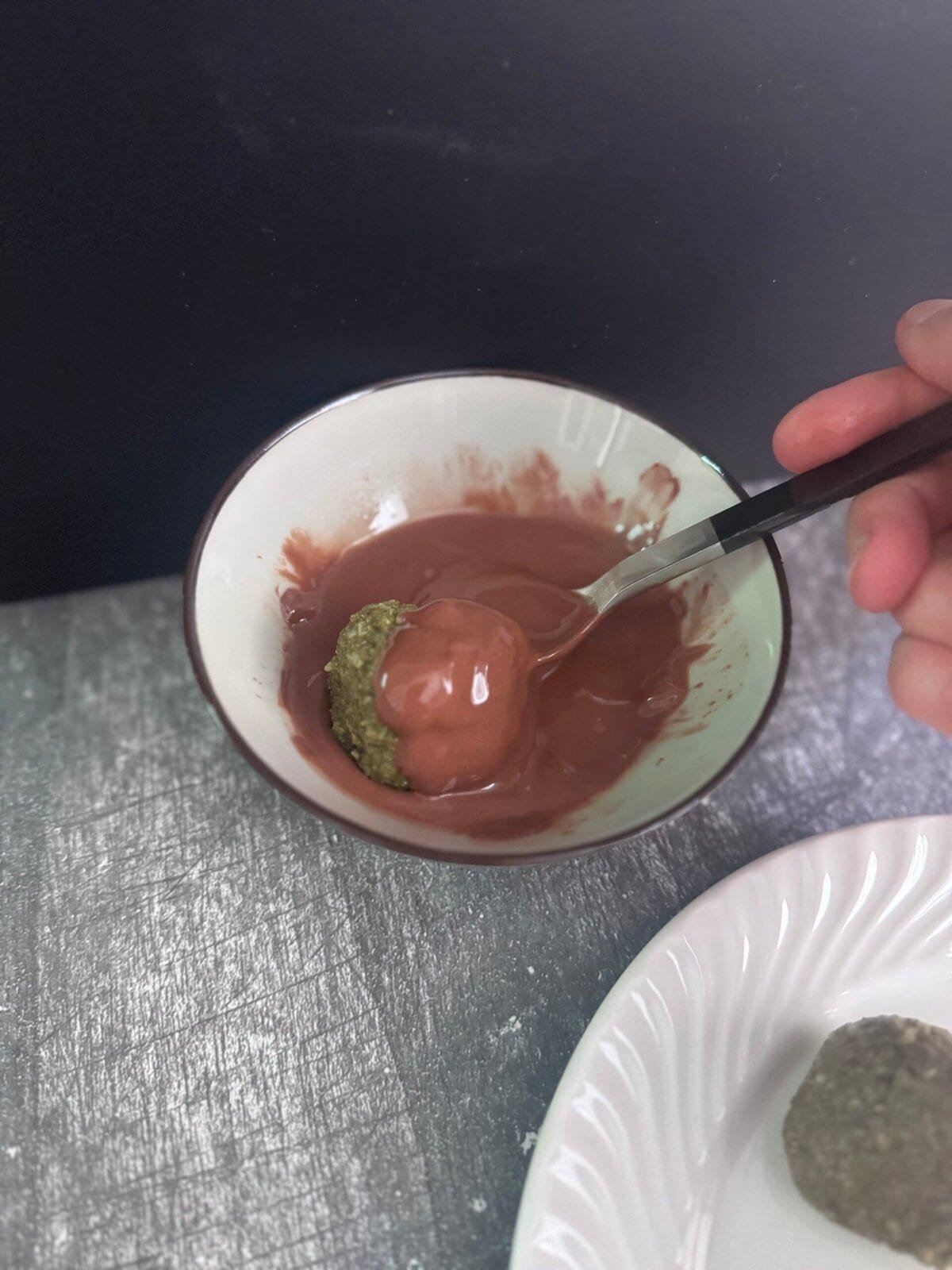 roll protein balls in melted chocolate glaze the protein balls