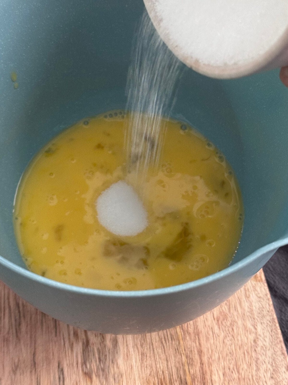 add sugar in the eggs add sugar in the eggs